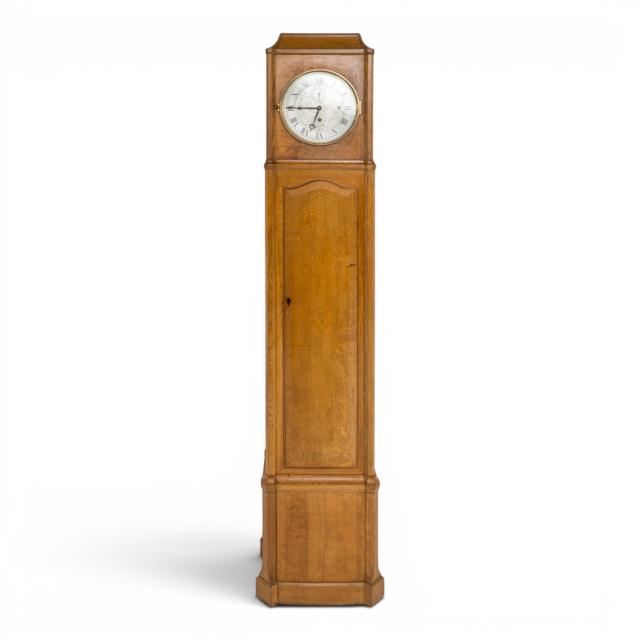Gordon Russell grandfather clock. Paper label to the back of the clock which reads: Design number 27, by Gordon Russell, foreman Edgar Turner, cabinet maker F Shilton, metal worker A Fry, the timber used English brown oak, 18.10.1927.